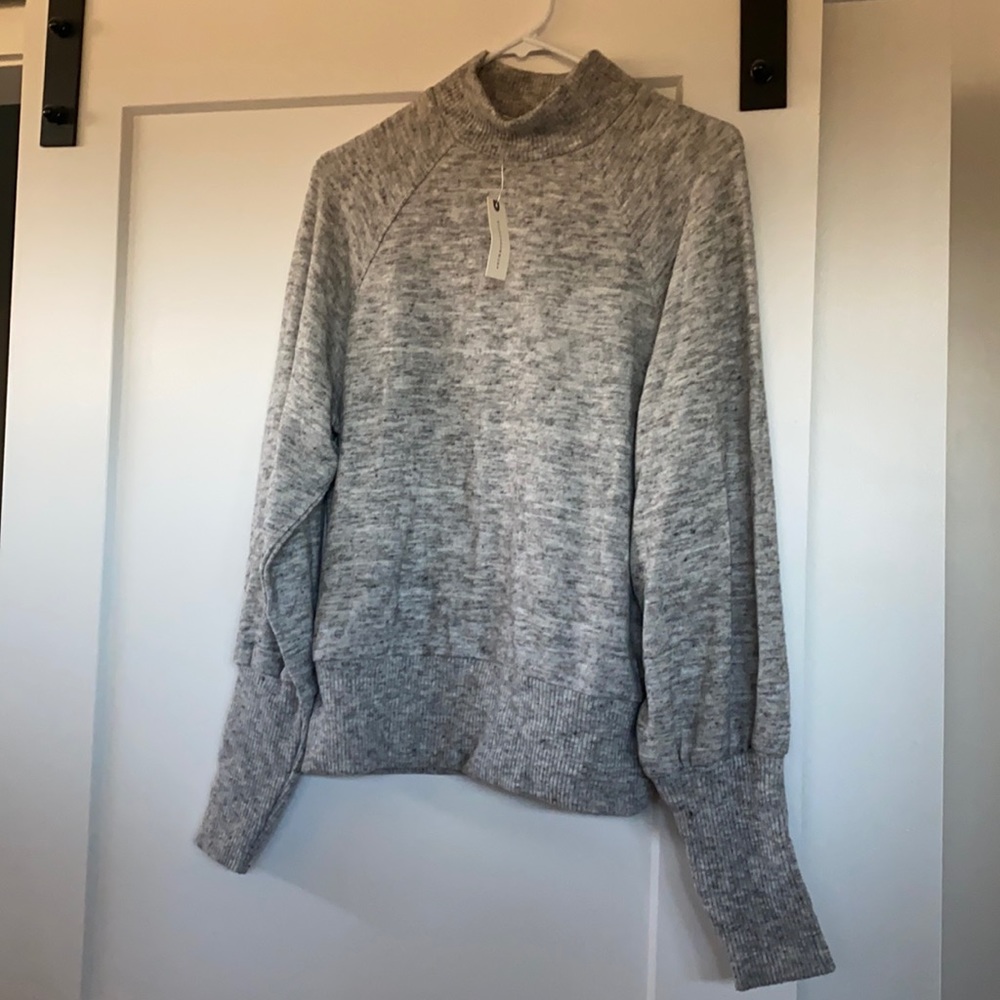 Grey Anthropologie sweater. Size small. Never been worn - still has tags.